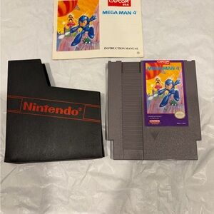 Nintendo Mega Man 4 NES Cartridge with manual and sleeve tested and works